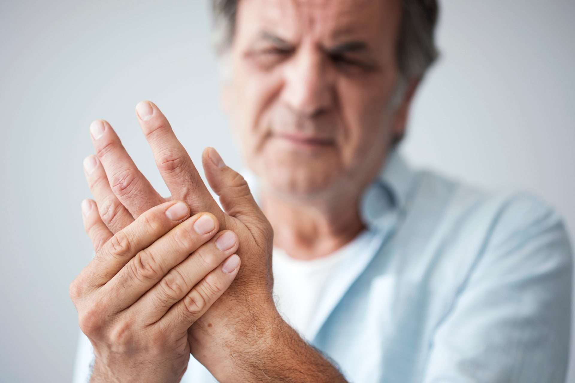 old man with finger pain